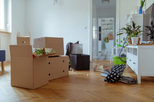 istock Unpacked boxes on parquet floor in the new apartment 1209218647