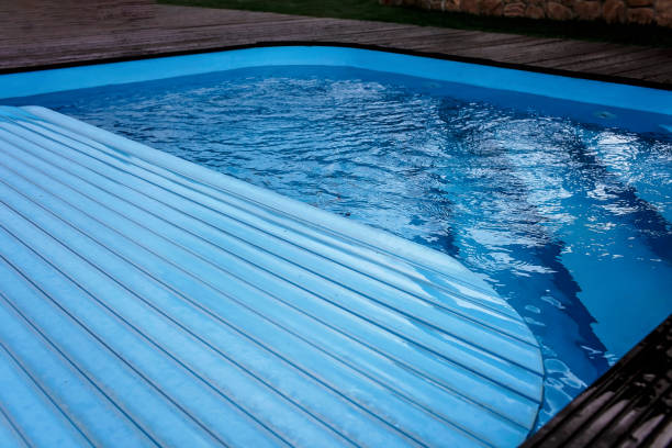 istock Automatic swimming pool covering system, home and cottage equipment 1209219905