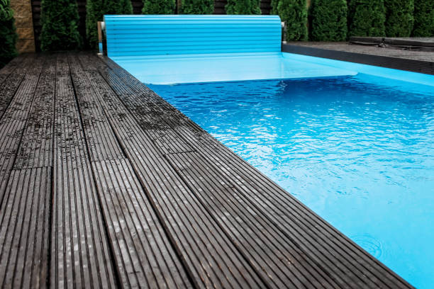 automatic swimming pool covering system, home and cottage equipment - covering imagens e fotografias de stock