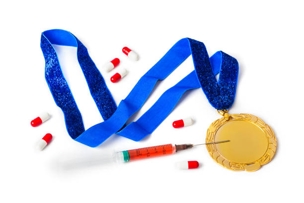istock Gold medal with syringe and pills 1209224877