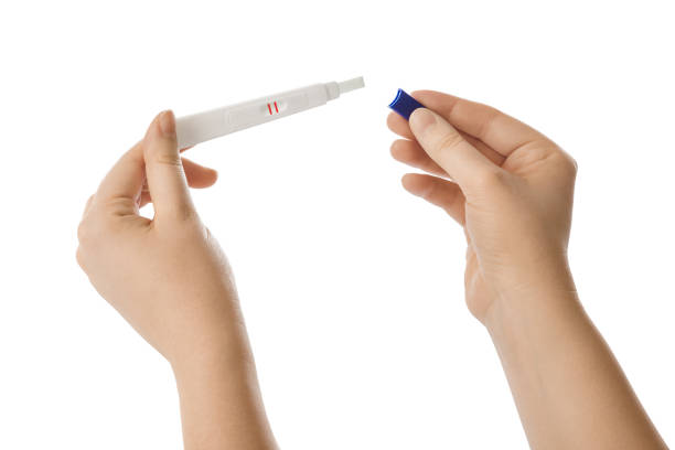 istock Woman hands with pregnancy test 1209224884