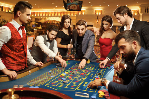 istock Friends make bets gambiling at the roulette table in the casino. 1209227882