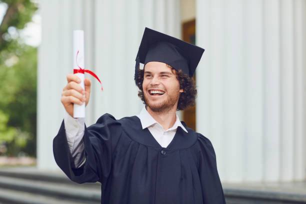 istock A young man graduate is smiling on university graduates. 1209228441