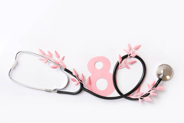 istock Flat lay stethoscope with paper leaves on white background. top view 1209230283