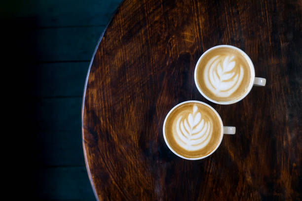 istock Two cups of cappuccino with latte art. 1209231632