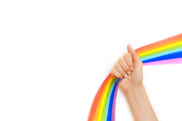 istock hand with unicorn manicure on white background 1209233071