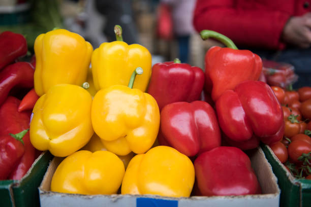 Fresh organic red and yellow pepper at open market