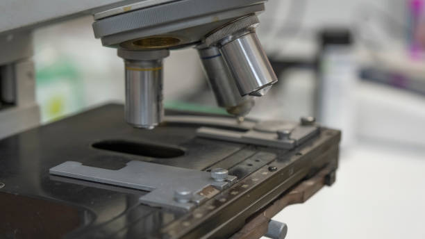 istock Medical microscope closeup. Scientific microscope lens. A microscope - an instrument used to see very small objects 1209237444