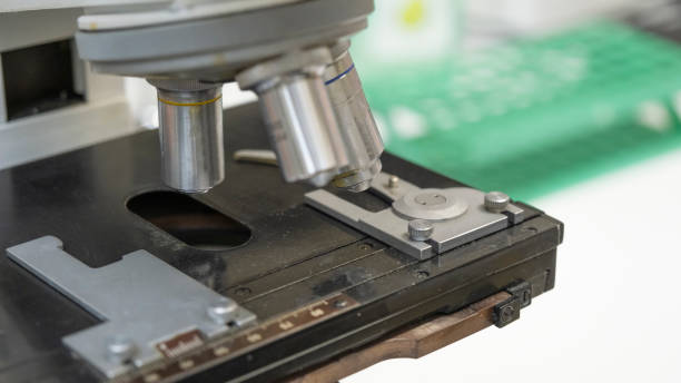 istock Medical microscope closeup. Scientific microscope lens. A microscope - an instrument used to see very small objects 1209237456