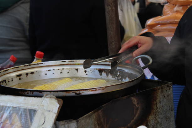 istock Fried potatoes seller from a local bazaar 1209244567