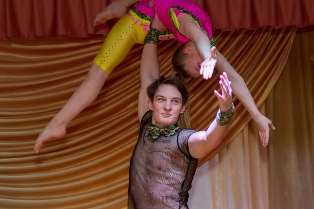 Handsome guy and girl perform acrobatic number