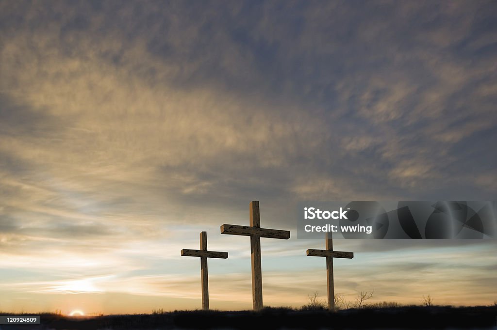 Three crosses on Good Friday with setting sun and  copy. Three crosses on a hill at dawn. Good Friday Stock Photo