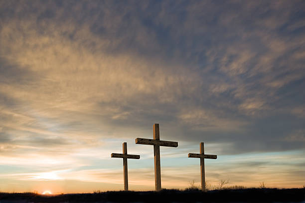 Three crosses on Good Friday with setting sun and  copy. Three crosses on a hill at dawn. crucifix photos stock pictures, royalty-free photos & images