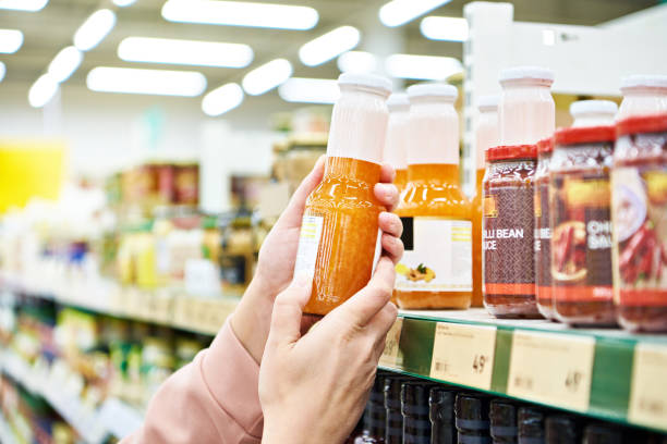 Culinary sauce in hand buyer at store
