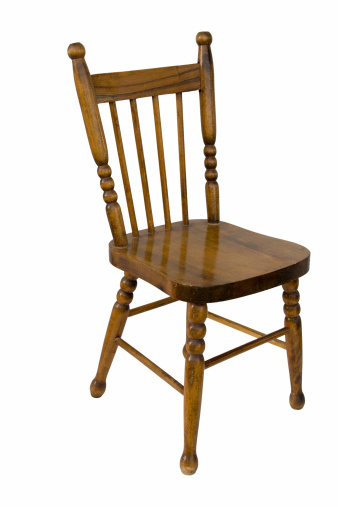 A wood antique childre's chair. Isolated