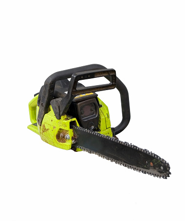 A well used and worn chainsaw isolated with room for copy.