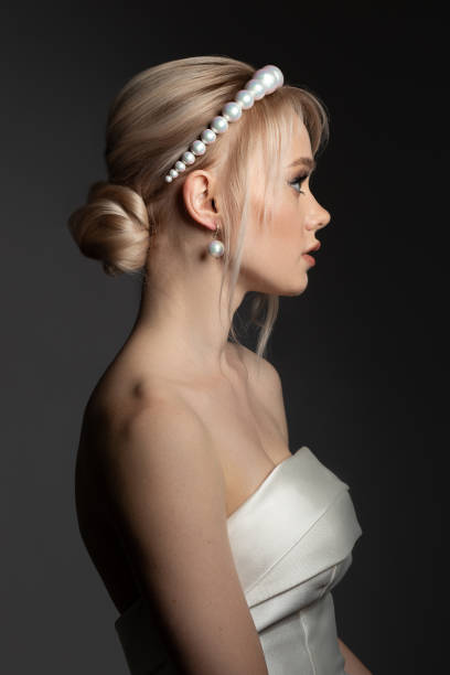 Beautiful bride wearing pearl diadem and earrings Beautiful bride wearing pearl diadem and earrings hairstyle bride jewelry women stock pictures, royalty-free photos & images