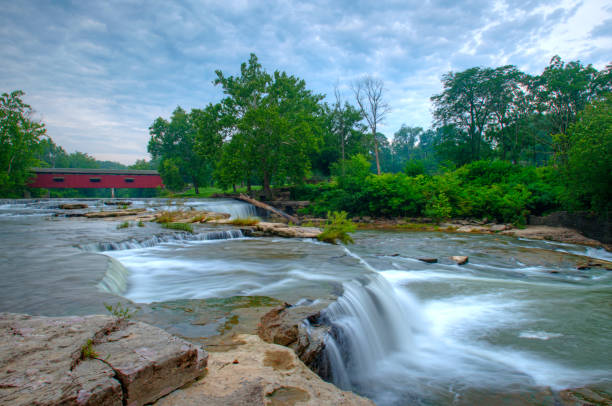istock Waterfall-Cataract Falls-with covered bridge- On Mill Creek-Owen County Indiana 1209254175
