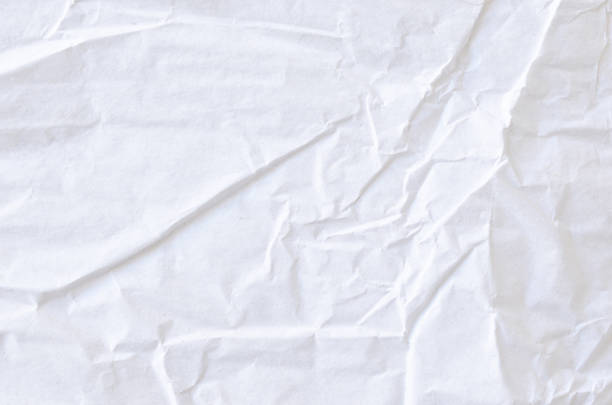 istock Creative background with scattered overlay of crumpled white paper. 1209255805