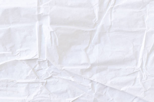 istock Creative background with scattered overlay of crumpled white paper. 1209255806