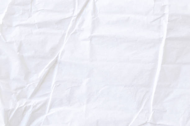 istock Creative background with scattered overlay of crumpled white paper. 1209255939