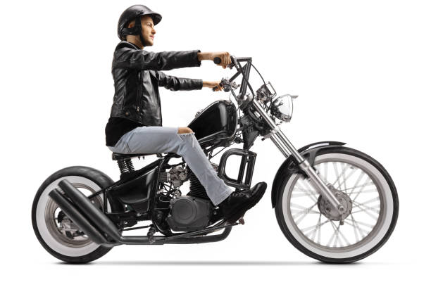 istock Biker riding a custom chopper motorbike 1209257565