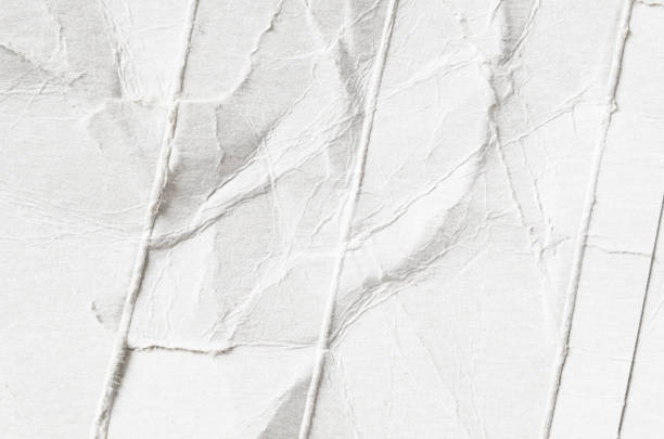istock Creative background with scattered overlay of crumpled white paper. 1209258286