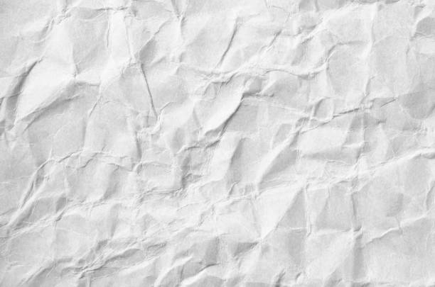 istock Creative background with scattered overlay of crumpled white paper. 1209258374