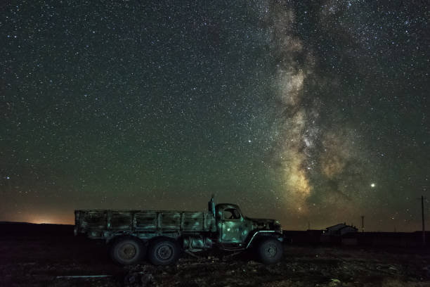 istock Milky way over a scrap truck 1209258534