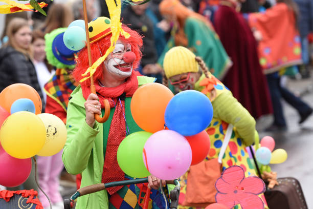 Great Torrington, England - May 4, 2013: Clowns in the Grand Carnival. The annual street parade closes the May Fair which has taken place in the Devon town since the sixteenth century