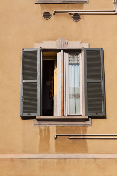 Single opend window at facade in Bergamo
