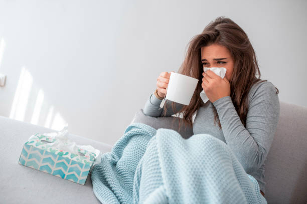 istock Woman Is Exhausted and Suffering From Flu 1209260200