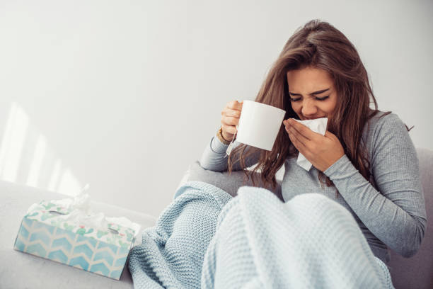 istock Woman Is Exhausted and Suffering From Flu 1209260350