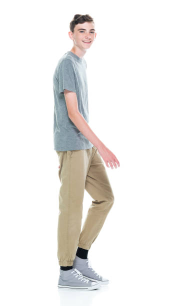 istock Caucasian young male walking in front of white background 1209263761
