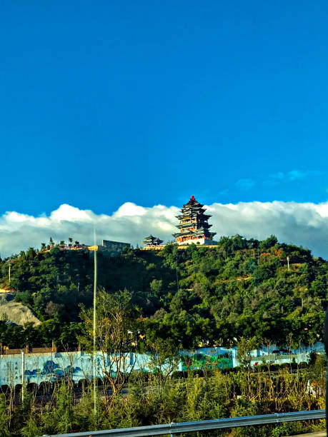 istock The ancient Chinese temple or castle on the hill and a blue sky with clouds. 1209263765