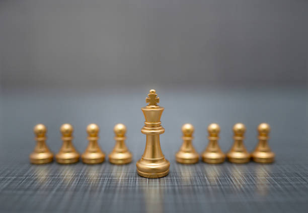 istock golden chess pieces on dark background 1209263787