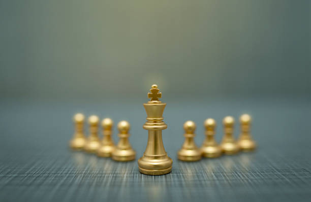 istock golden chess pieces on dark background 1209263801