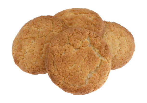 istock Four coconut flavor cookies on a white background 1209265793