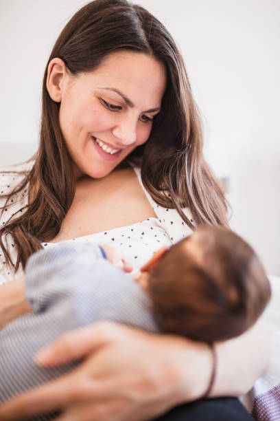istock Young mother breastfeeding her baby boy 1209267112
