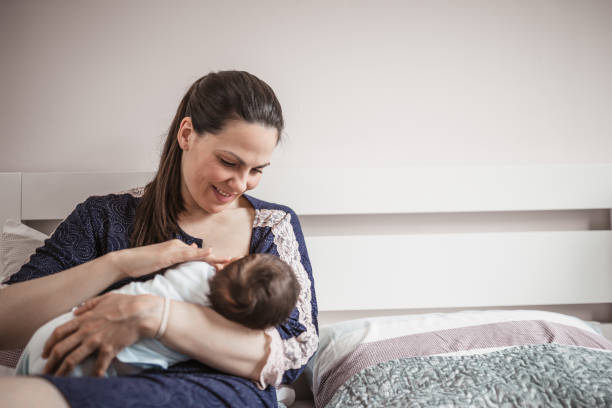 istock Young mother breastfeeding her baby boy 1209267188