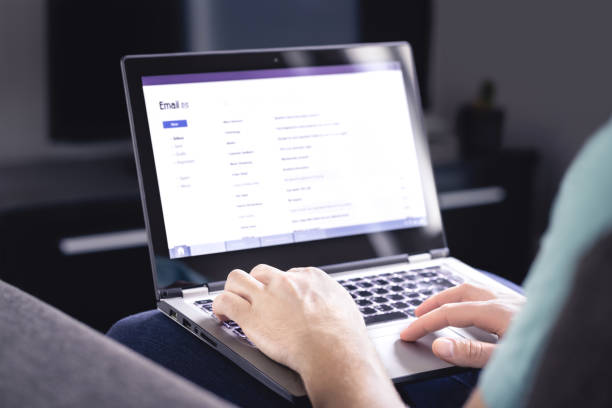 istock Email inbox on laptop screen. List of messages. Man checking received e mail. Spam, junk and digital marketing. Read, reply or forward posts. Person working from home with computer 1209272441