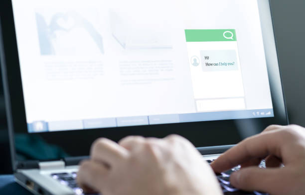 istock Chatbot or live chat with customer help assistant on business website. AI technology and conversation with automated messages. Client care and service. 1209272542