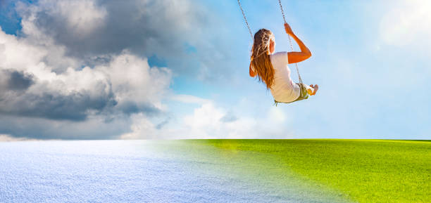 istock A woman swings from winter to spring 1209272923
