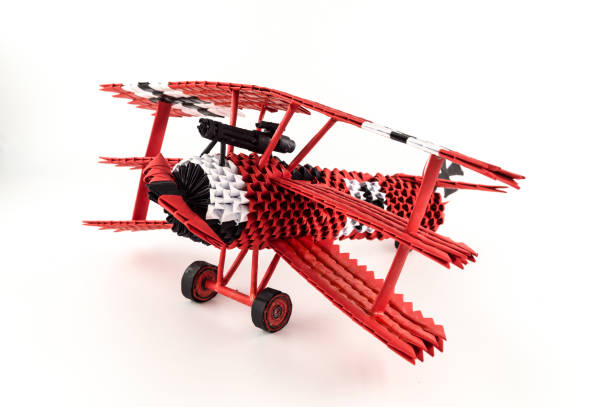 istock Origami red baron plane 1209273091