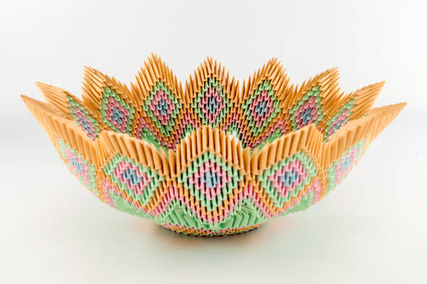 Fruit dish of all origami colors on a white background