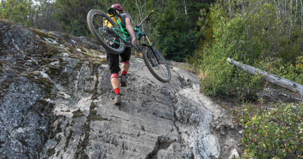 istock Mountain biker ascends steep rock slab 1209276996