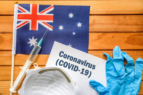 Coronavirus in Australia. Flag of Australia, vaccine, face mask for virus, glove and paper sheet with words Coronavirus COVID-19 antibiotic resistant photos stock pictures, royalty-free photos & images