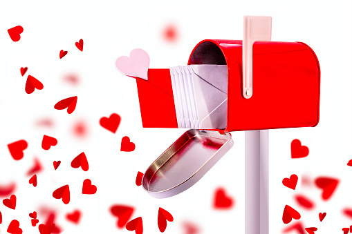 Love letter in the mailbox and red hearts, concept love and romance