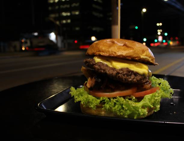 homemade hamburger sandwich with lettuce tomato and bacon