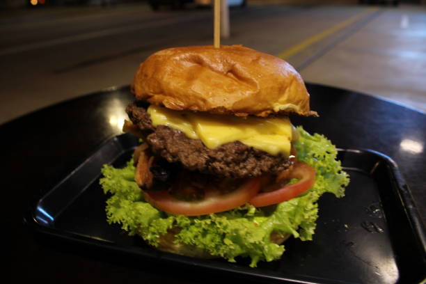 istock homemade hamburger sandwich with lettuce tomato and bacon 1209286928